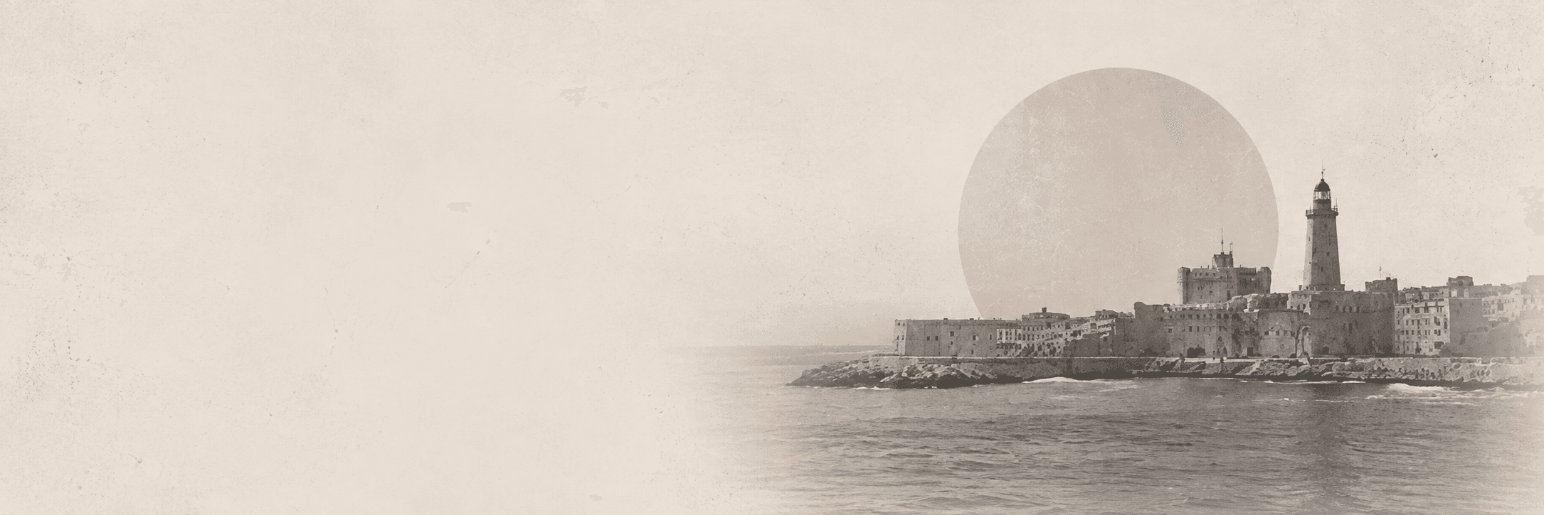 Sepia photograph of Qaitbay fort and the lighthouse on Alexandria's harbour beneath a pale sun